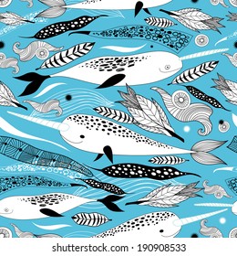 Graphic seamless pattern with whales on a blue background  