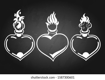 Graphic set of flaming hearts isolated on chalkboard background. Vector old school tattoo design. Traditional style