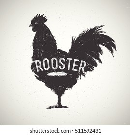 Graphic silhouette of a rooster and inscription.