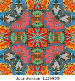 Graphic vector pattern. A seamless background. Abstract ornament. Orange, blue and pink texture. Wallpaper in the geometrical style.