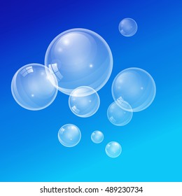 Graphic vector transparent bubbles on a blue background. 