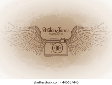 Graphic vintage camera with two wings. Conceptual art for web sites, business cards and other corporate identity for the photographers.