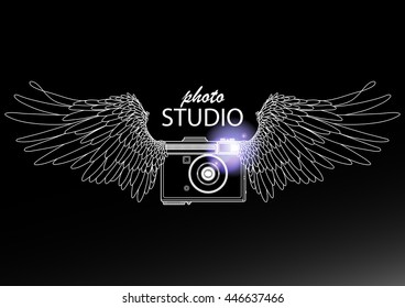 Graphic vintage camera with two wings. Conceptual art for web sites, business cards and other corporate identity for the photographers.