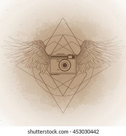 Graphic vintage camera with two wings. Conceptual art for web sites, business cards and other corporate identity for the photographers.