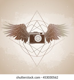 Graphic vintage camera with two wings. Conceptual art for web sites, business cards and other corporate identity for the photographers.