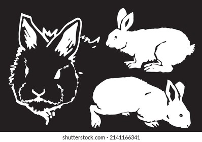 Graphical set of bunnies isolated on black,vector engraved elements