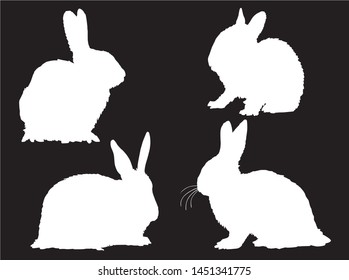Graphical set of bunny silhouettes isolated on black background,vector illustration