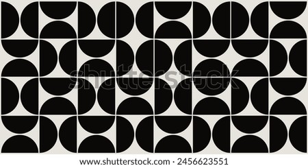 Graphical shapes of half circles and squares in black and beige. The classic Bauhaus style pattern design.