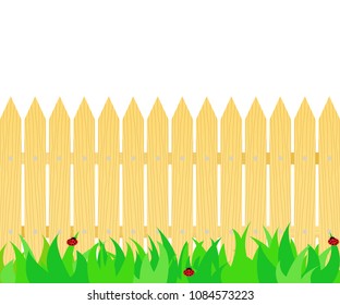 Grass in front of the fence.