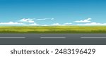 Grassland on sunny day with empty road