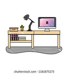 grated office desk with computer and lamp with books