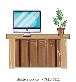 grated wood desk with computer screen and plant