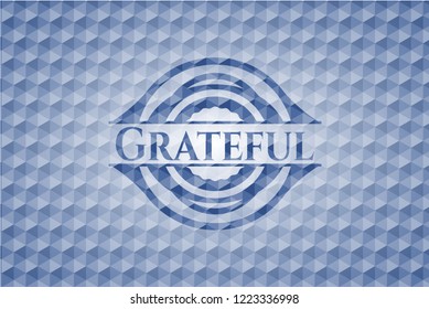 Grateful blue emblem with geometric pattern background.