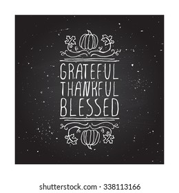 Grateful, thankful, blessed. Hand sketched graphic vector element with pumpkins, maple leaves and text on chalkboard background.  Thanksgiving design.