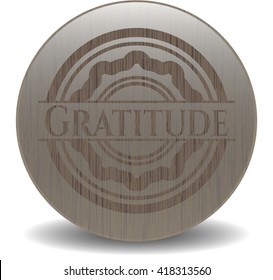 Gratitude badge with wooden background