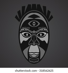 Gray african mask on a black background