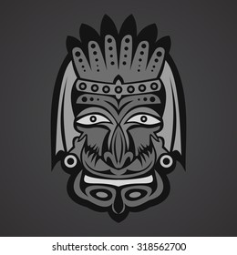 Gray african mask on a black background