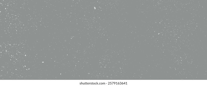 Gray background with a speckled texture. The background is gray with a subtle, scattered pattern, creating a textured, artistic look. Speckled wall texture background. Gray background vector.