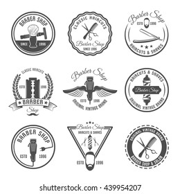 Gray barber emblem or label set with different shapes and hairdressing tools vector illustration