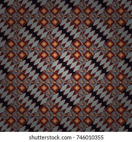 Gray, brown and orange ethnic geometric motif seamless pattern in gray, brown and orange on abstract background.