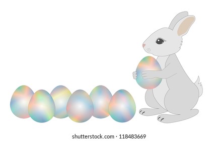 Gray bunny holds in paws an Easter egg, lying next six eggs. You can add your own text.