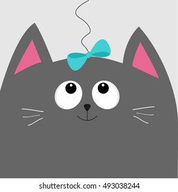 Gray cat head looking at blue bow hanging on thread. Cute cartoon character. Pet baby collection Card. Flat design. Vector illustration.