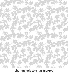 Gray clover leaves on a white background. Seamless modern pattern