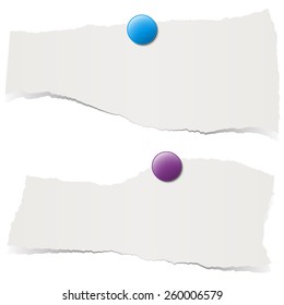 gray colored scrap of paper with pin needle
