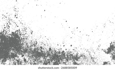 Las partículas de polvo gris se dispersan sobre un fondo blanco creando un patrón texturizado y abstracto.