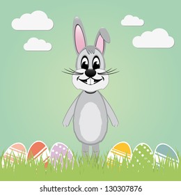 gray easter bunny lawn and colorful eggs