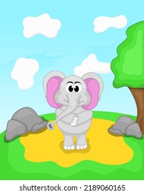 gray elephant standing on a green meadow