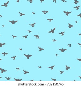 gray flying birds on a blue background. Seamless pattern. Modern stylish texture. Freehand drawing vector.
