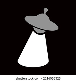 gray flying saucer with abduction light and black background