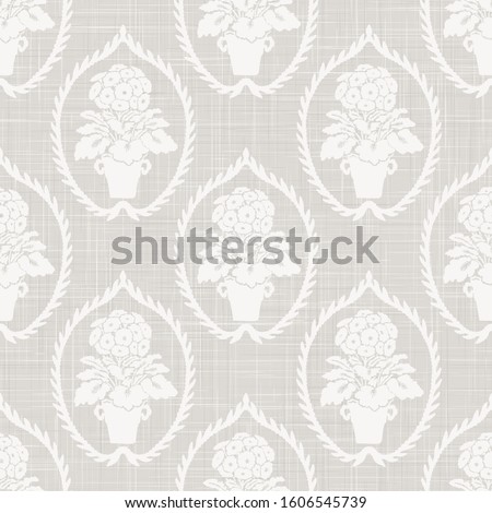 Gray french linen texture background printed with white primrose motif. Natural ecru antique medallion seamless pattern. Organic woven leaf foulard paisley wallpaper, vintage homespun textile damask.