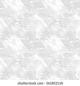 Gray grunge seamless pattern with abstract hand drawn brush strokes and paint splashes. Messy infinity texture, modern grungy background. Vector illustration. 