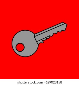 Gray metal key on red background.