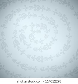 Gray ornament on spiral, with light on the middle