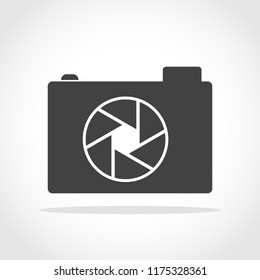 Gray photo camera icon in flat design. Vector illustration. Camera icon isolated on white background.