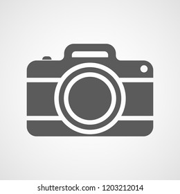 Gray photo camera icon in flat design. Vector illustration. Camera icon isolated on white background.