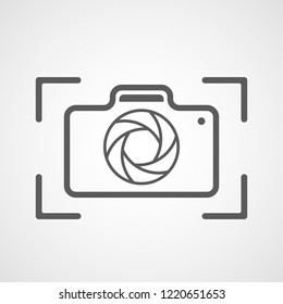 Gray photo camera icon in flat design. Vector illustration. Camera icon isolated on white background.