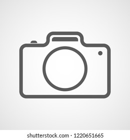 Gray photo camera icon in flat design. Vector illustration. Camera icon isolated on white background.