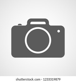 Gray photo camera icon in flat design. Vector illustration. Camera icon isolated on white background.