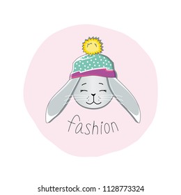 Gray rabbit with closed eyes in a multi-colored hat on a round pink background