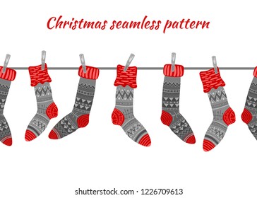 Gray and red christmas socks on a white background. Seamless vector pattern