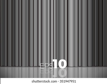 Gray or silver closed satin fabric curtains in a theater