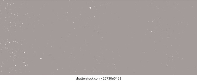 Gray speckled background with a textured, dusty appearance. The background is gray with subtle white speckles, creating a soft, muted effect. Speckled wall texture background. Gray background vector.