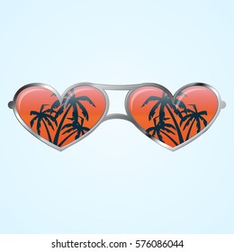 Gray sunglasses with heart shape and palms in mirror