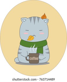 Gray tabby cat with green scarf and coffee cup