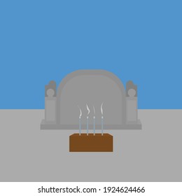 gray tombstone with incense on cement with light blue background