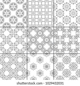 Gray and white floral ornaments. Collection of neutral seamless patterns for paper, textile